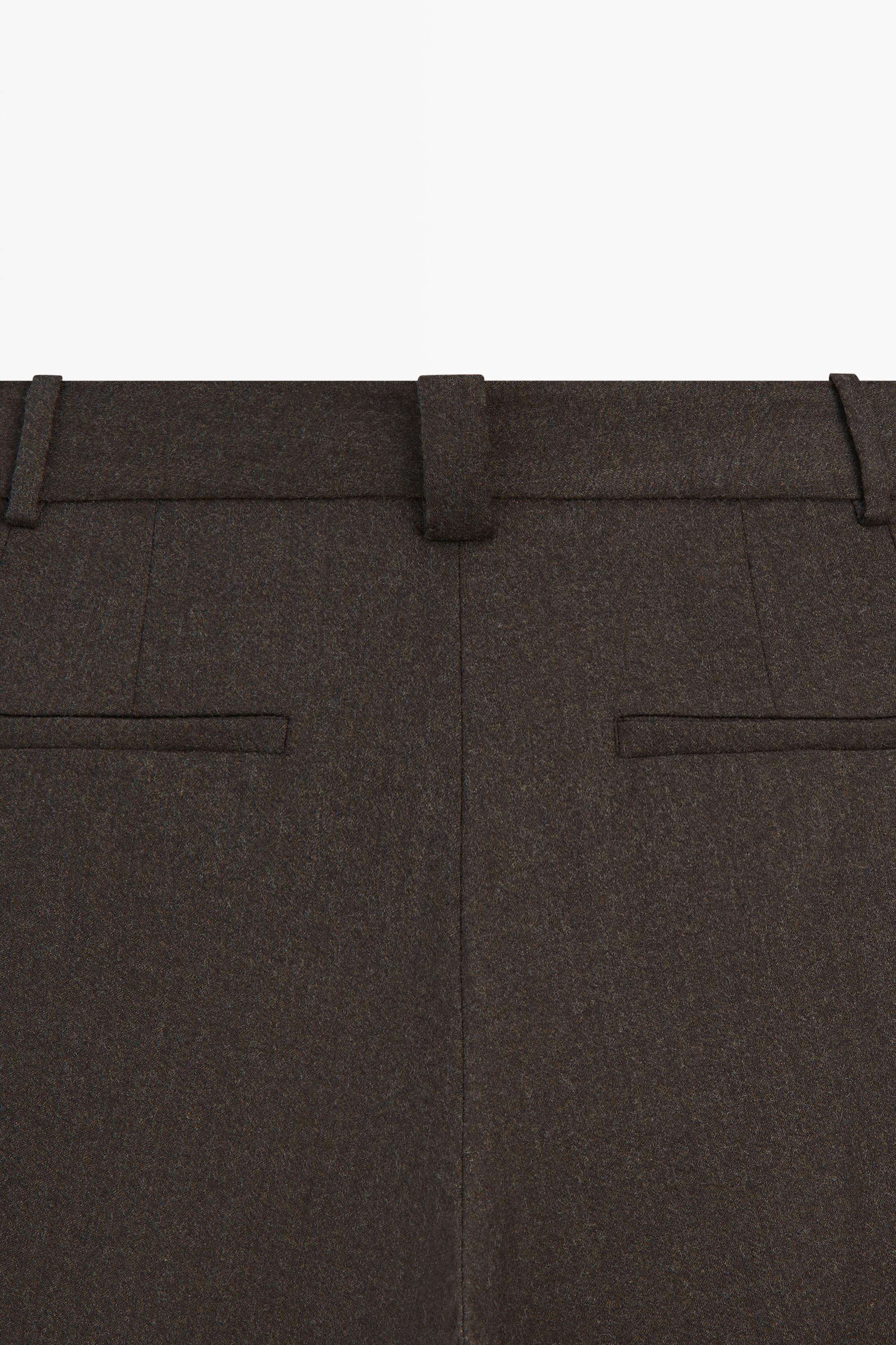 Pleated flannel trousers with hem detail